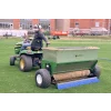 man spreading sand on a 54D spreader 1 768x512.png
